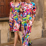 Kobiety w kolorowych, artystycznych sukienkach i spodniach z motywem lalek, stylowa moda polska